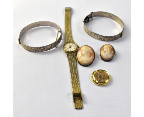 Various items of costume jewellery to include two silver hinged bracelets, two silver mounted cameo brooches, a Rotary ladies