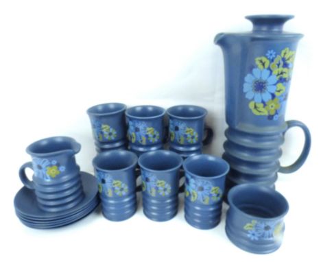 CARLTON WARE; a vintage fifteen-piece blue 'Wellington' pattern coffee set with floral decoration on a blue ribbed ground, co