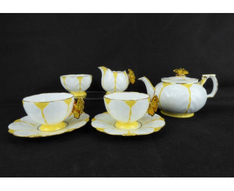 AYNSLEY; an Art Deco yellow cabbage leaf seven-piece morning tea set, pattern B1322, with butterfly teapot finial and butterf