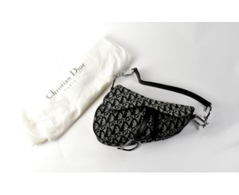 CHRISTIAN DIOR; a black monogram canvas and calfskin leather saddle bag with white metal Christian Dior logo hardware, height