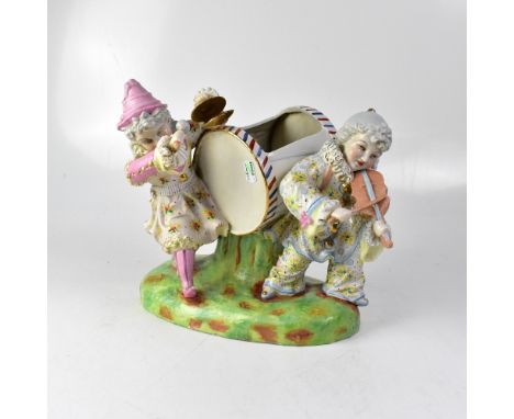 A 19th century Austrian porcelain figure group modelled as a couple of clowns, one dressed in blue playing the violin, the ot