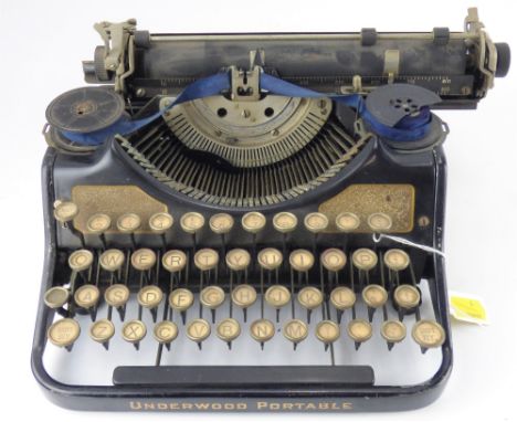 THE UNDERWOOD; a vintage black portable typewriter.