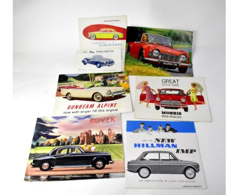 A selection of 1960s British car brochures, including Mini, Rover, Hilman and Sunbeam.