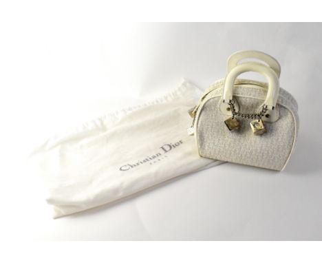 CHRISTIAN DIOR; a white and silver Christian Dior logo canvas and white calfskin leather 'Gambler Dice' bag with white metal 