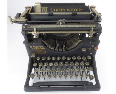 THE UNDERWOOD; a vintage black and metal bodied typewriter.