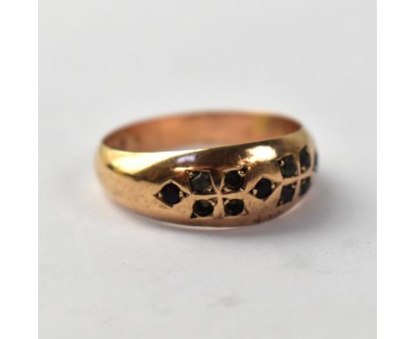 A vintage 9ct gold ring, size P, approx 2g. CONDITION REPORT: some inset red and white stones, three white missing 