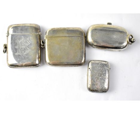 An Edward VII hallmarked silver sovereign case of lozenge form, with engine turned decoration, Birmingham 1909, together with