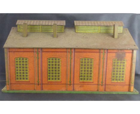 HORNBY MECCANO; a lithograph printed tin plate model railway engine shed, length 50cm.