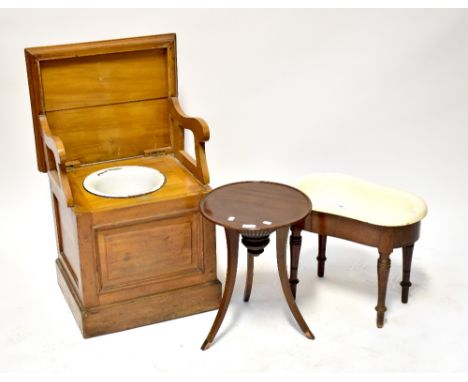 An early 20th century mahogany commode with lift-up top and fold-out arms, blue and white enamelled interior bowl, 49 x 51 x 