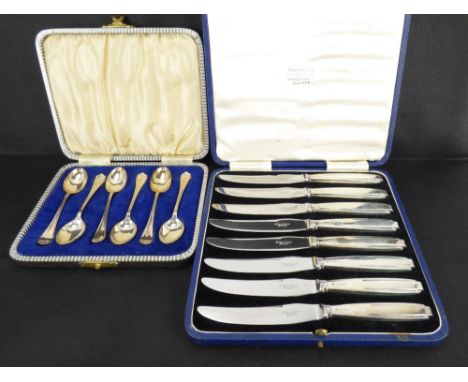 A set of eight Art Deco style dessert knives with filled silver handles and stainless steel blades, in presentation case and 