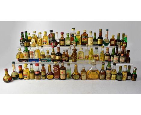 Over sixty miniature alcohol bottles to include Cusnier Apricot Brandy, Grant's Standfast Scotch Whisky, John Haig Dimple Whi