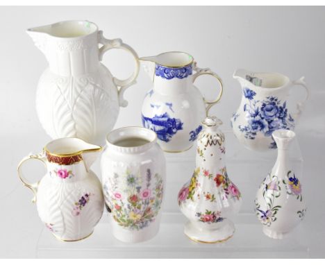 COALPORT; a white ground 'The Caughley' mask head jug, originally produced around 1770, height 19cm, a mask head jug with han