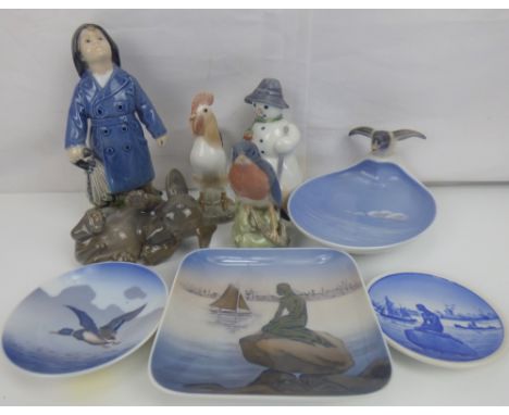 ROYAL COPENHAGEN; various collectible porcelain figures, to include a boy wearing a rain mac with umbrella, height 18cm, a pl