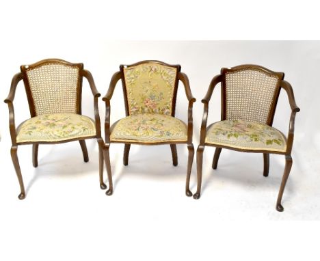 Three matching Edwardian open arm salon chairs, two with bergère backs, all with matching tapestry seats, on cabriole legs (3