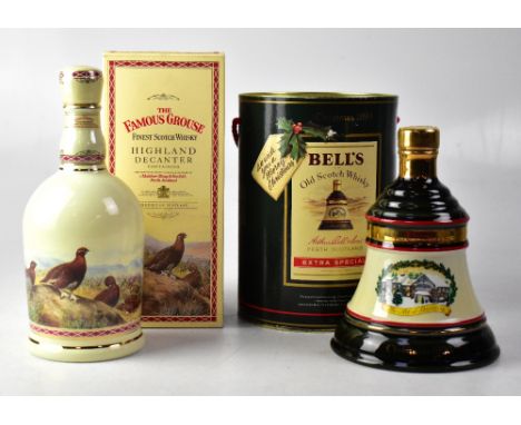 A boxed bottle of The Famous Grouse Finest Scotch Whisky Highland decanter, 70cl, and a Bell's Christmas 1990 extra special w