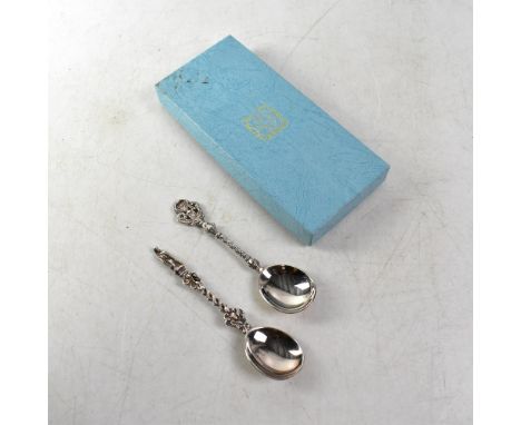 Two Elizabeth II hallmarked silver anointing-style spoons, one with twist stem and apostle finial, the other with Celtic stem