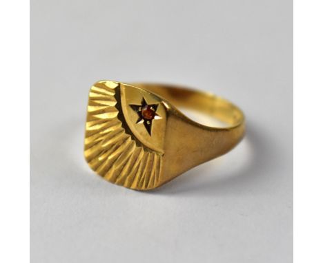 A 9ct gold gentlemen's vintage signet ring, set with small orange stone in star mount, with sunburst effect, size V, approx 3