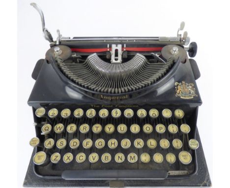 THE IMPERIAL; a cased vintage black bodied metal typewriter.