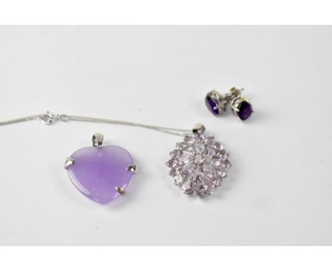 SWAROVSKI; a silver pendant set with amethyst in a flower head style, marked SCS, together with a pair of TGGC amethyst stud 