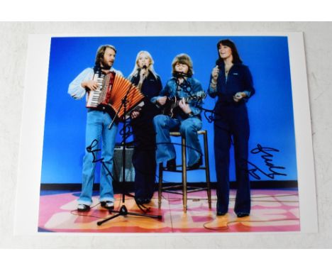 ABBA; colour photograph, signed.We have not authenticated these signatures, please satisfy yourself as to the veracity of the