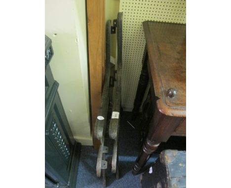 A PAIR OF CAST IRON BENCH ENDS together with six hardwood slats