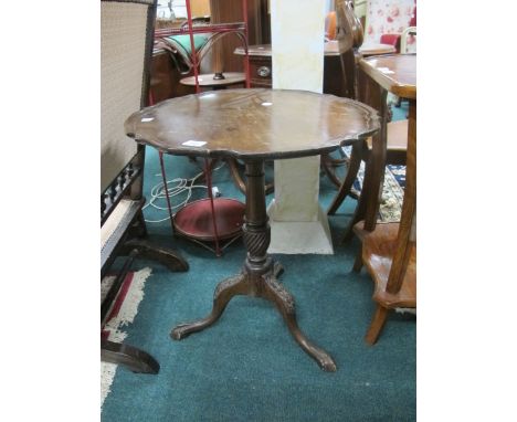A GEORGIAN STYLE MAHOGANY SNAP TOP OCCASIONAL TABLE the circular top with pie crust rim above a baluster column on tripod sup