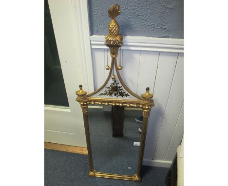 A GOOD REGENCY STYLE GILTWOOD AND GESSO MIRROR the rectangular plate between reeded pilasters with Corinthian capitals the sh