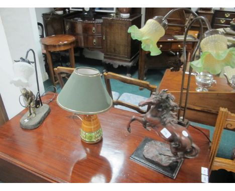 A COMPOSITION TABLE LAMP modelled as a golfer together with a composition and metal table lamp modelled as a horse together w