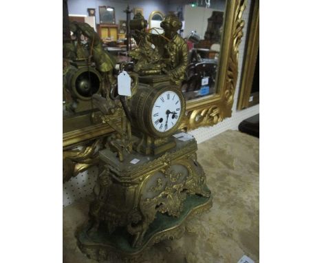 A FRENCH GILT BRASS CLOCK 19th Century surmounted by a male shown watering plants the enamel dial with Roman numerals above a