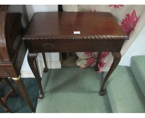 A CHIPPENDALE STYLE MAHOGANY OCCASIONAL TABLE the rectangular top with gadrooned rim and frieze drawer on cabriole legs with 