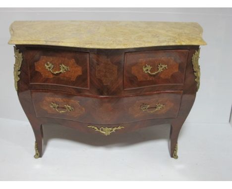 A CONTINENTAL KINGWOOD WALNUT AND GILT BRASS MOUNTED COMMODE of bombe outline surmounted with a sienna marble top above two s