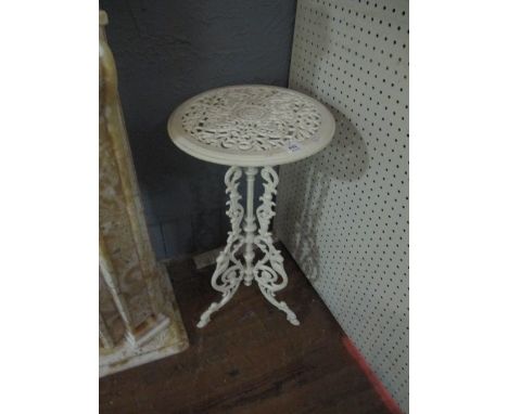 A CAST IRON JARDINIERE STAND the circular pierced top above a baluster column on pierced tripod support with claw feet 