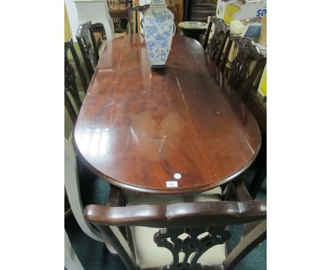 A SEVEN PIECE CHIPPENDALE STYLE MAHOGANY DINING SUITE comprising six chairs including a pair of elbow chairs each with a pier