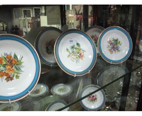 AN EIGHTEEN PIECE ROYAL WORCESTER FRUIT SET comprising seventeen side plates and comport the white ground with central floral