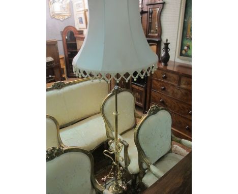 A VICTORIAN BRASS FLOOR STANDARD LAMP the cylindrical column with barley twist and C scroll decoration above a platform base 