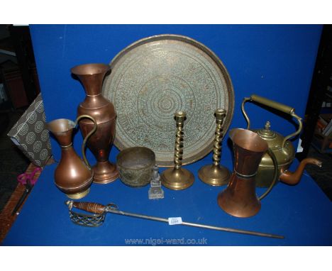 A quantity of Copper and Brass including kettle with acorn finial, spiral candlesticks, vases, poker, etc. all on brass easte