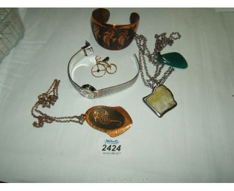 A Ladies Wristwatch, copper Bangle and pendant, silver chains and pendants.