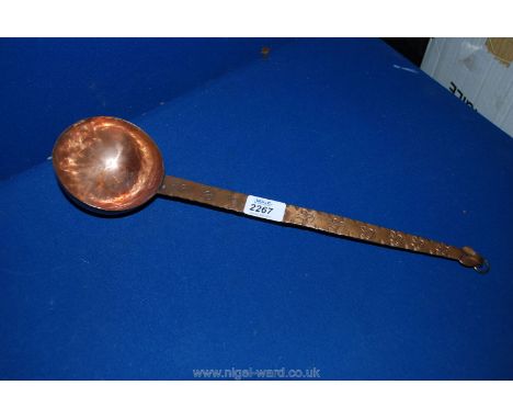 A hand-made Copper Ladle with incised decoration to handle