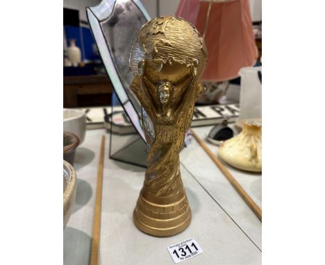 Ceramic FIFA world cup trophy, H: 27 cm. P&amp;P Group 2 (£18+VAT for the first lot and £3+VAT for subsequent lots) 