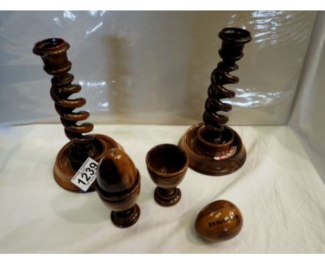 Pair of olive wood candlesticks H: 20 cm, a pair of Jerusalem napkin rings and two eggcups with wooden eggs, one candlestick 