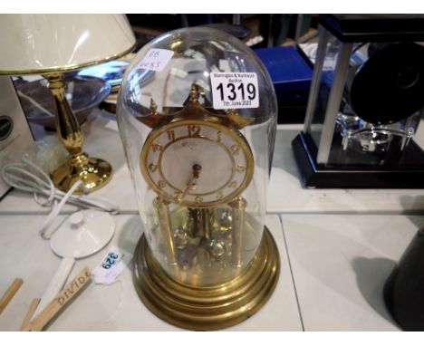 Glass domed anniversary clock with key, H: 21 cm, D: 13 cm. P&amp;P Group 3 (£25+VAT for the first lot and £5+VAT for subsequ