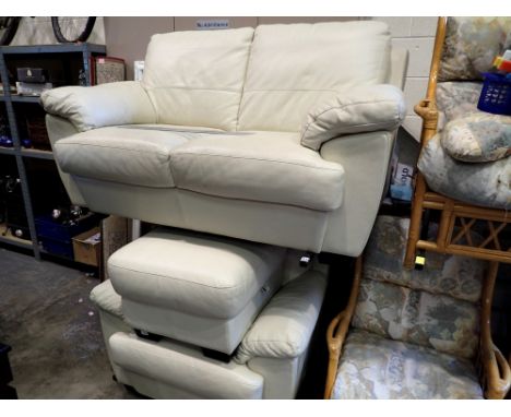 Cream leather two seat sofa and matching reclinerarmchair and pouffe. Not available for in-house P&amp;P 