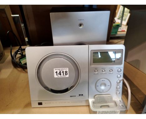 Teac Micro hi-fi system model MCDX 220 i DAB. All electrical items in this lot have been PAT tested for safety and have passe