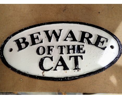 Cast iron Beware of the Cat sign, W: 15 cm. P&amp;P Group 1 (£14+VAT for the first lot and £1+VAT for subsequent lots) 