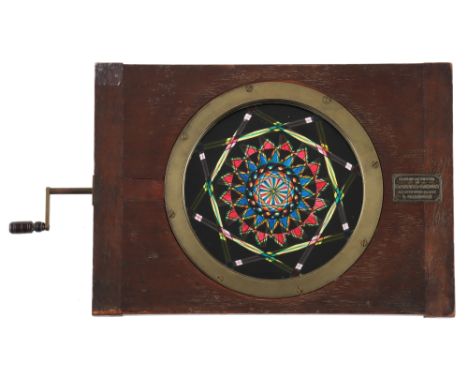 A Very Large Polytechnic Chromatrope Magic Lantern Slide, Large Mahogany Frame constructed in 3 parts, hand painted contra-ro
