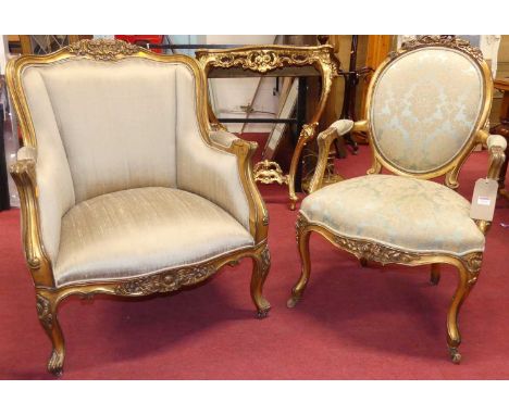 A circa 1900 French giltwood framed and pale silk upholstered fauteuil, in the Louis XV taste, w.73cm; together with a French