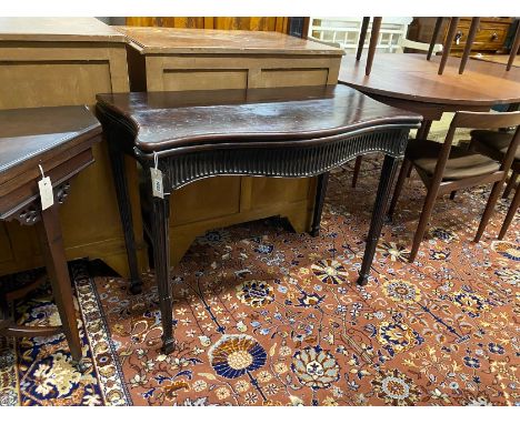 A George III mahogany serpentine folding card table, width 93cm, depth 48cm, height 72cm