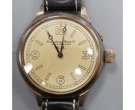 A Kriegsmarine style gun metal manual wind wrist watch, converted from a pocket watch, with later adapted dial, on a leather 