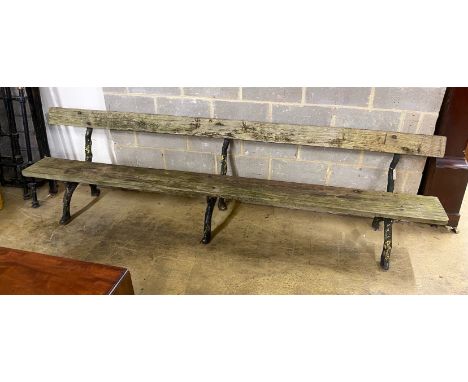 A Victorian cast iron garden bench with rustic ends and teak seat, length 305cm, depth 60cm, height 81cm