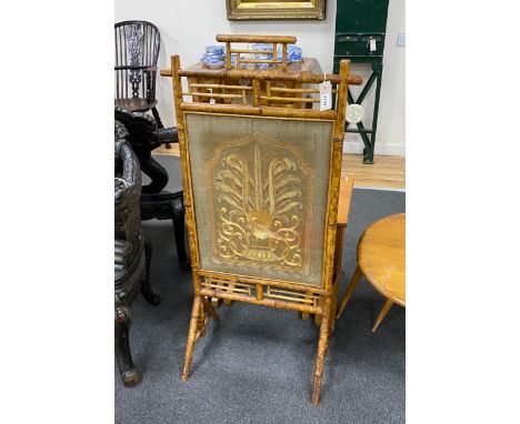 A Victorian bamboo firescreen with inset silk peacock banner, width 55cm, height 113cm